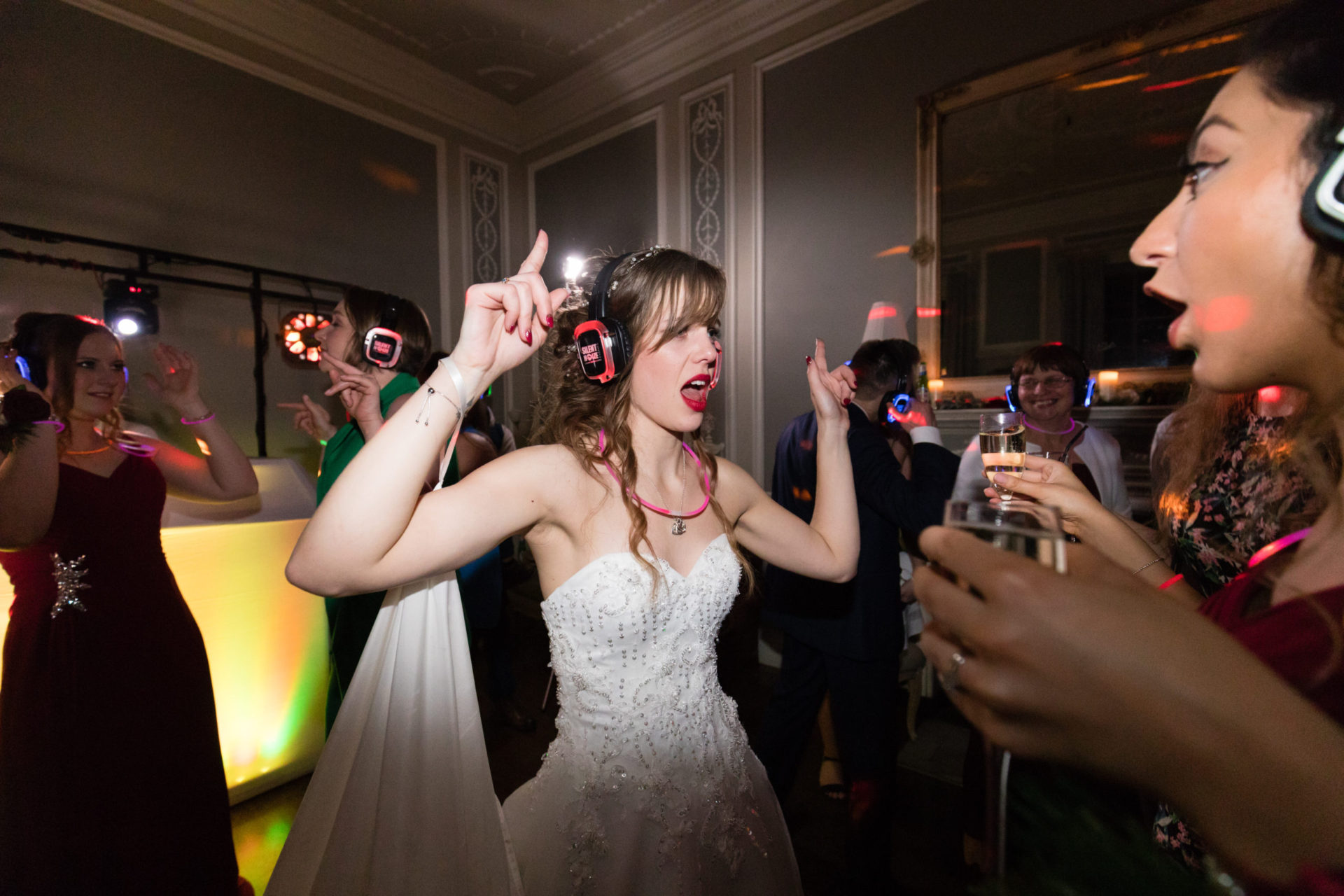 A bride wearing silent disco headphones