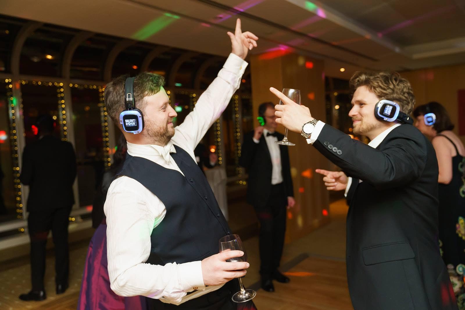 Two men partying at a silent disco